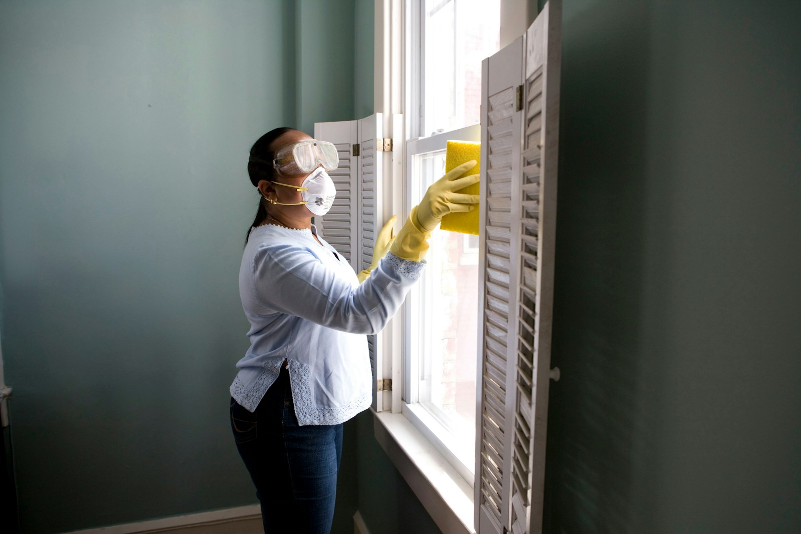 Rental turn cleaning and maintenance detail at a window